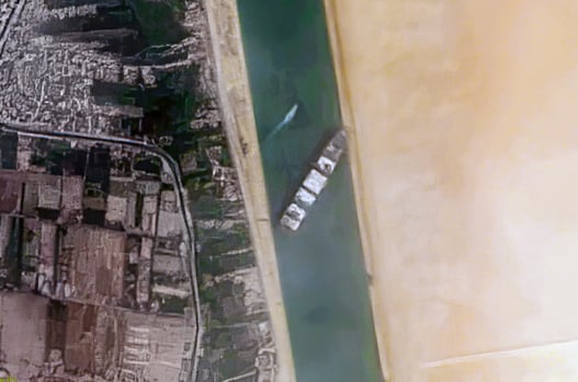 Container_Ship_Ever_Given_stuck_in_the_Suez_Canal,_Egypt_-_March_24th,_2021_cropped